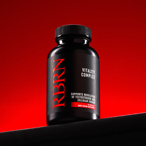 RBRN Vitality Complex men's testosterone support and cellular energy supplement bottle against a red-lit background